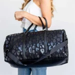 Custom leopard print duffel bag for women — large capacity travel bag with top zipper and dual handles in nylon and leather trim
